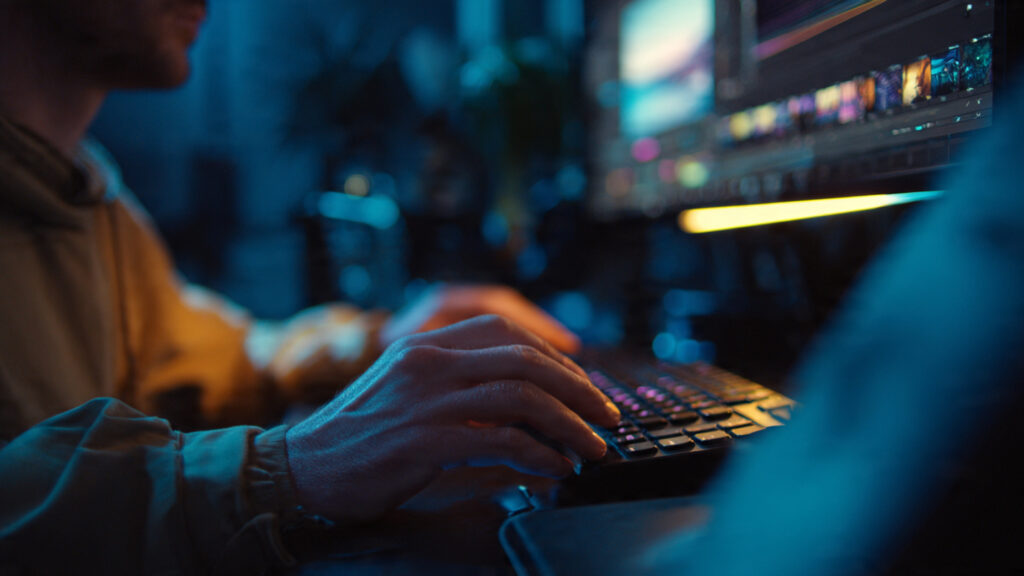 tech professional seated at a workstation with